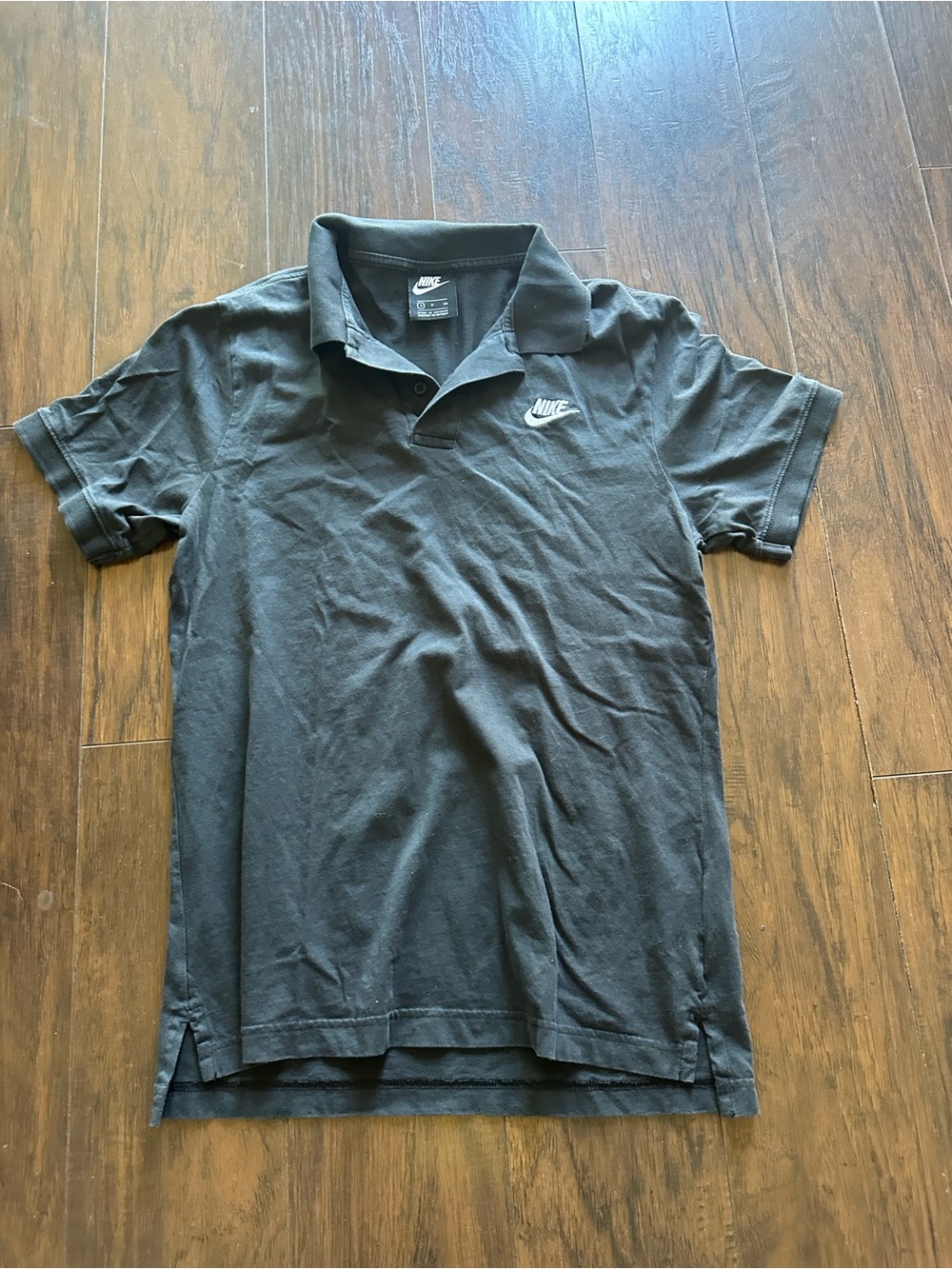 Nike Men's Black Polo with White Swoosh Logo
